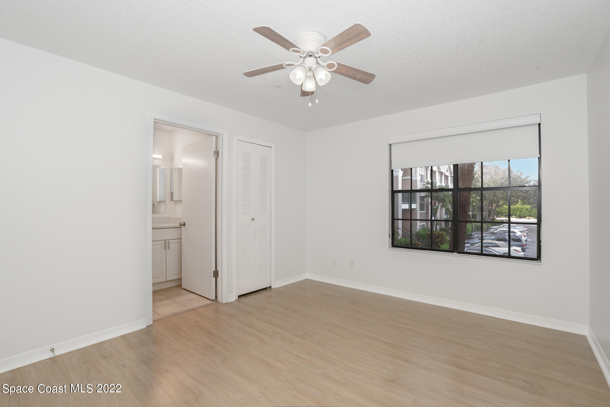 7667 North Wickham Road, Unit 113 Melbourne, FL 32940 - Photo 15 of 29 a view of an empty room with a window