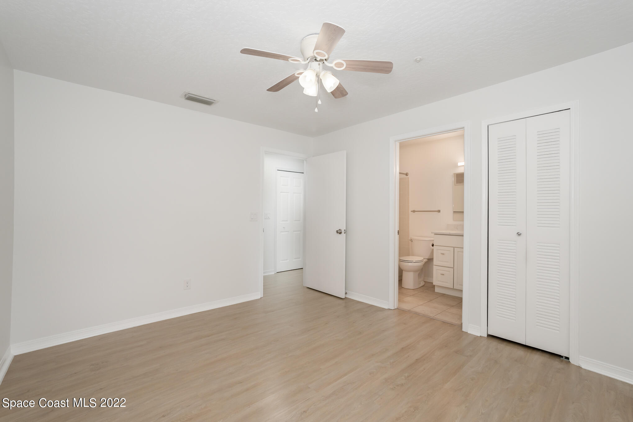 7667 North Wickham Road, Unit 113 Melbourne, FL 32940 - Photo 16 of 29 a view of an empty room and a ceiling fan window