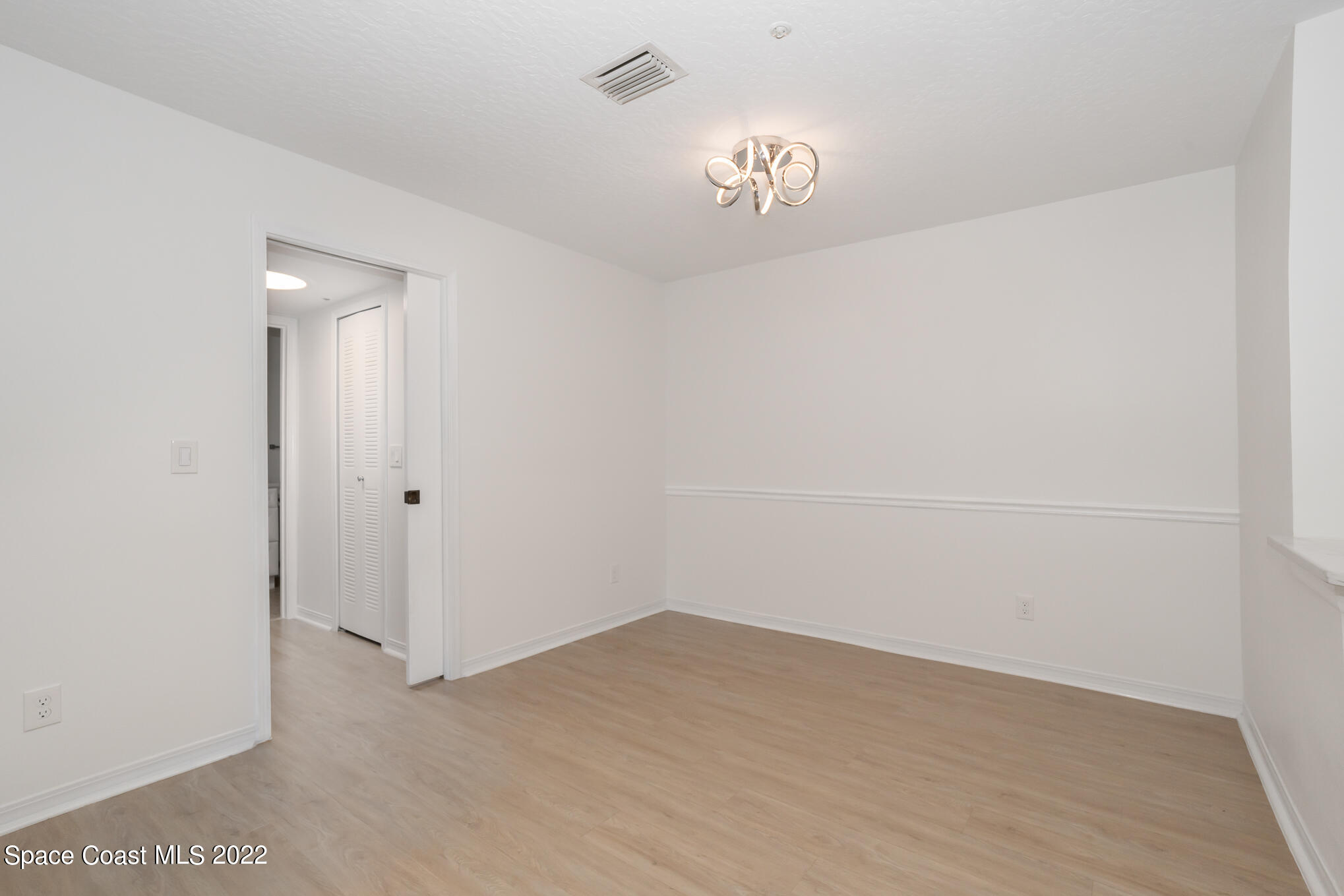 7667 North Wickham Road, Unit 113 Melbourne, FL 32940 - Photo 17 of 29 a view of an empty room