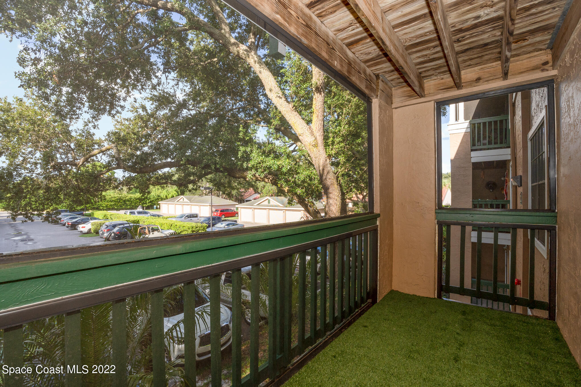 7667 North Wickham Road, Unit 113 Melbourne, FL 32940 - Photo 22 of 29 a view of a balcony with an outdoor space