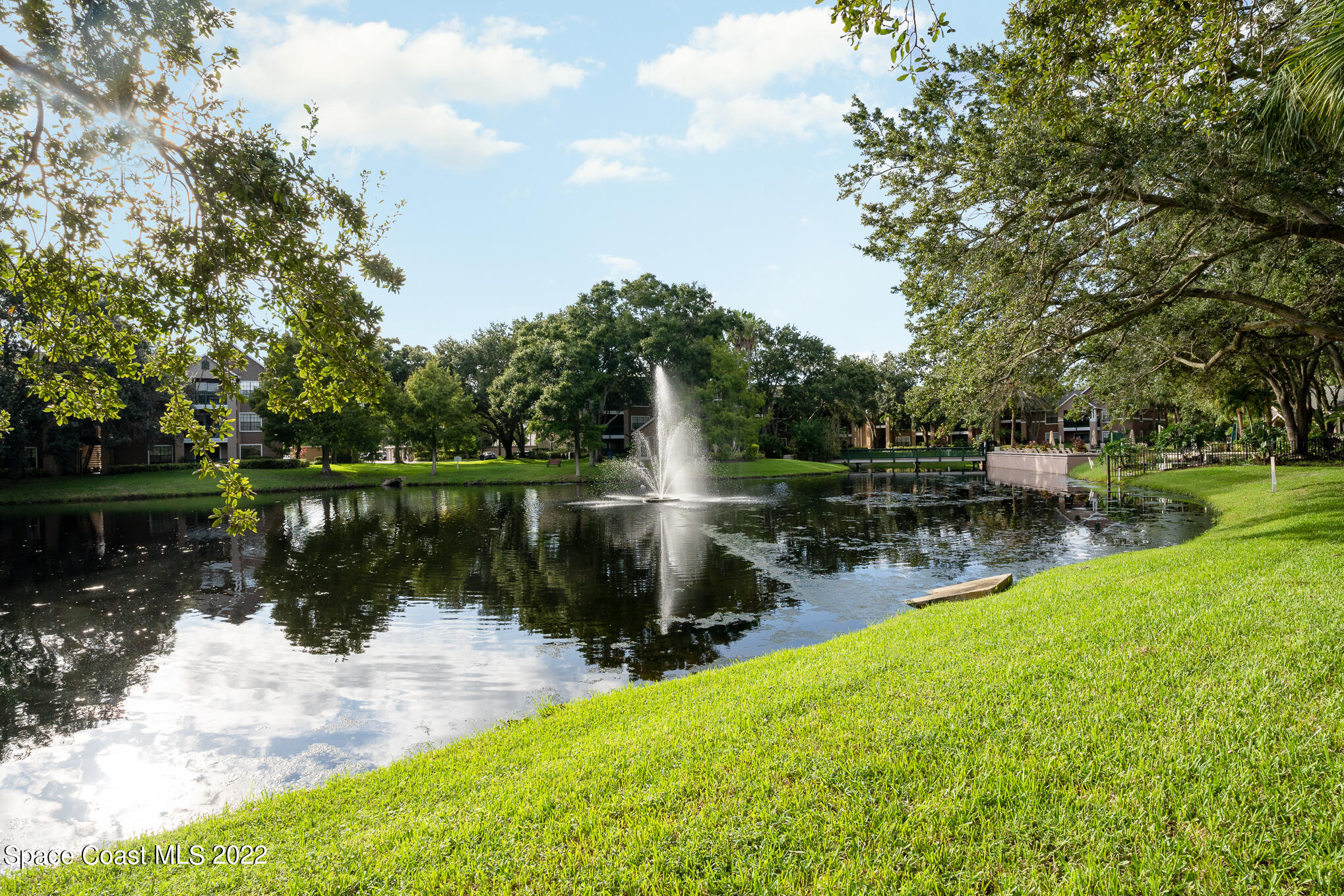 7667 North Wickham Road, Unit 113 Melbourne, FL 32940 - Photo 24 of 29 a view of a lake