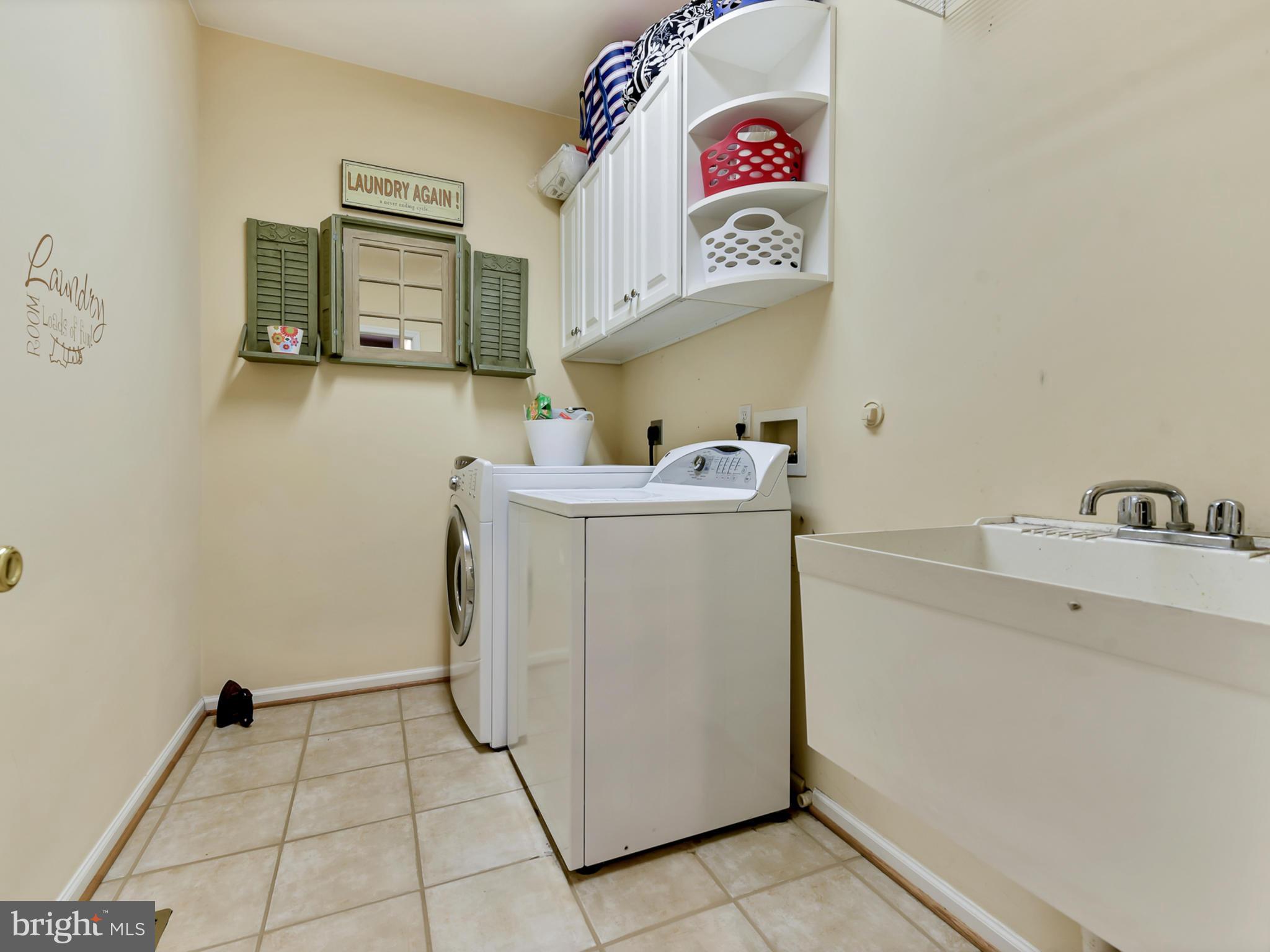 1834 Long Corner Road Mount Airy, MD 21771 - Photo 13 of 44 Large laundry room with a sink and cabinets.