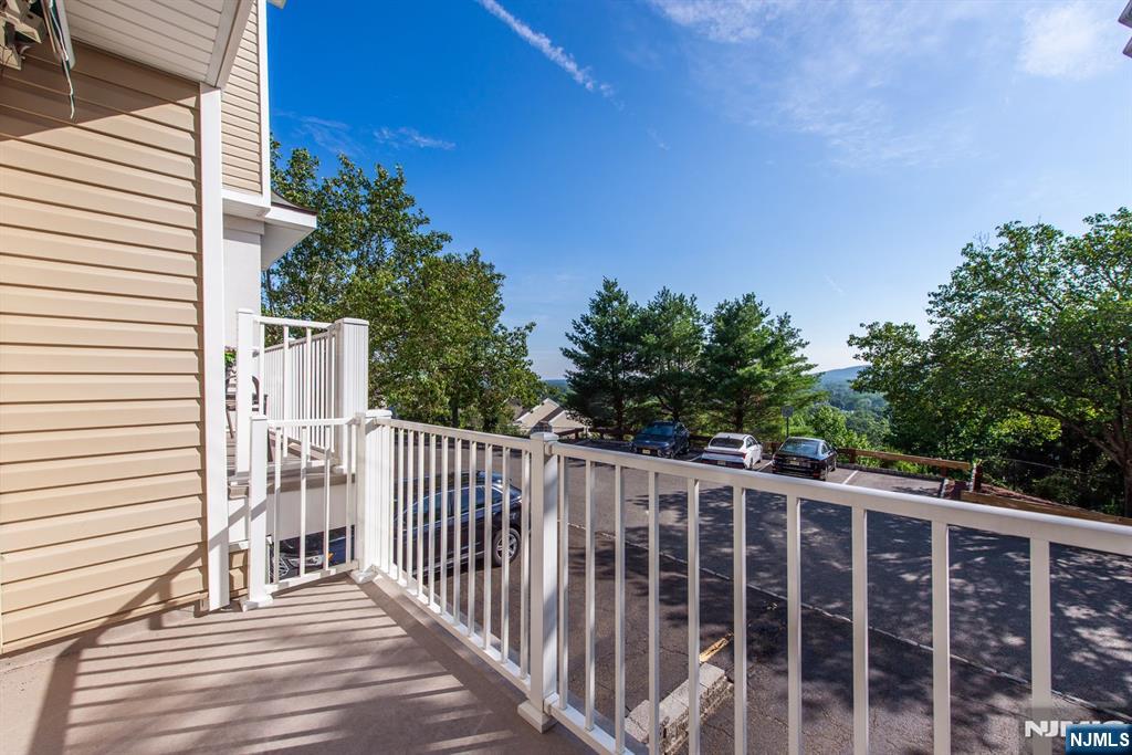 146 Summit Ridge, Unit 1406 Pompton Lakes, NJ 07442 - Photo 11 of 26 a view of a wooden fence