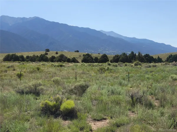 a view of a town with mountains in the background