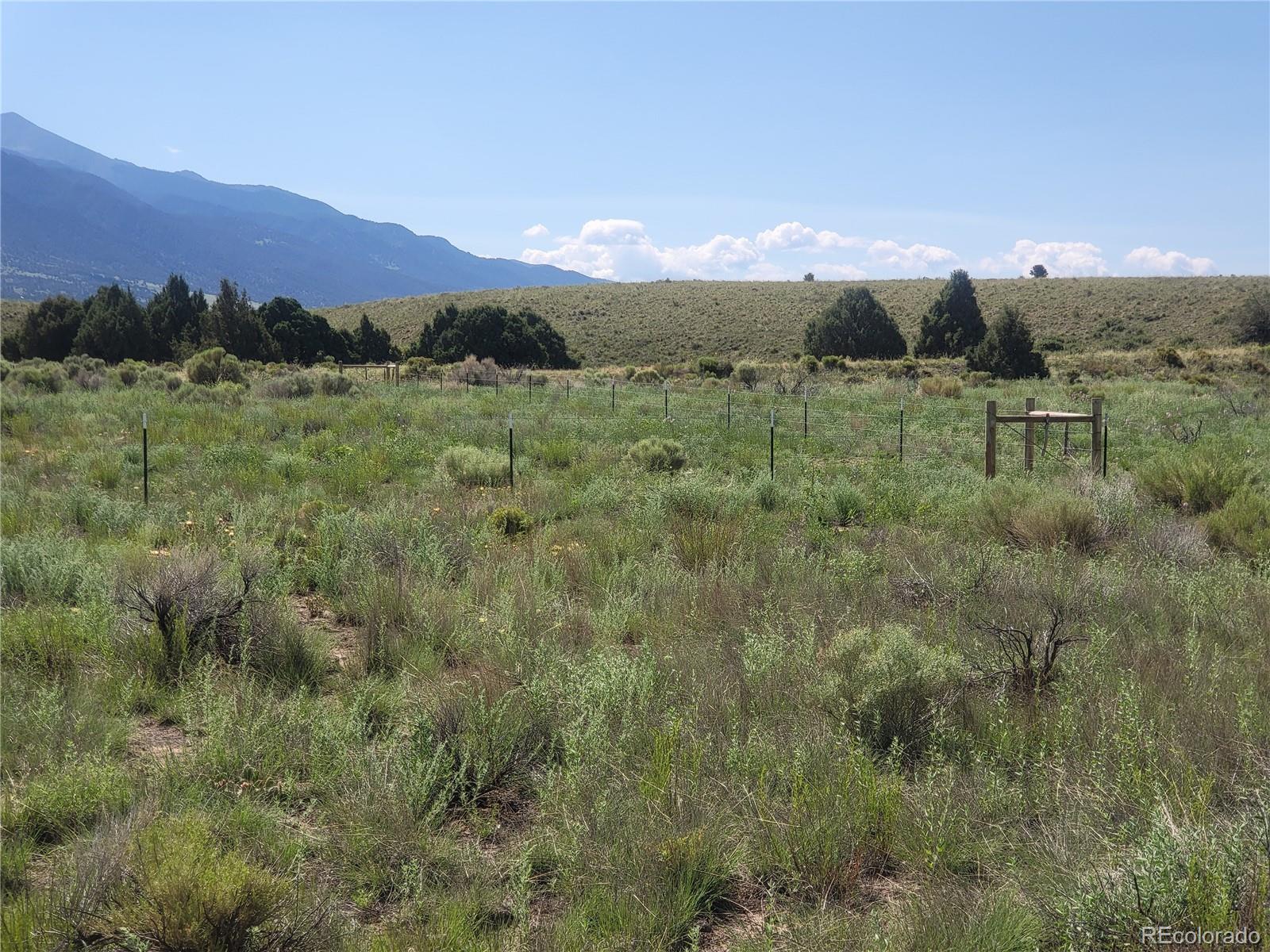 993 Pinon Road Crestone, CO 81131 - Photo 19 of 42 a view of a town with mountains in the background