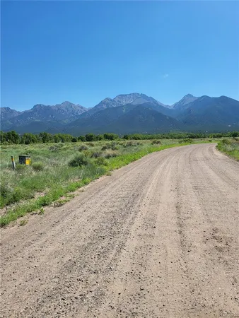 a view of a city with lush green forest