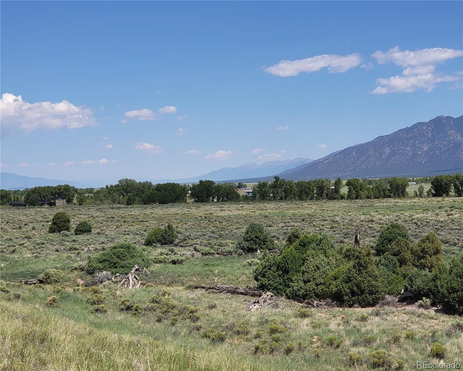 993 Pinon Road Crestone, CO 81131 - Photo 32 of 42 a view of a lake in middle of the forest