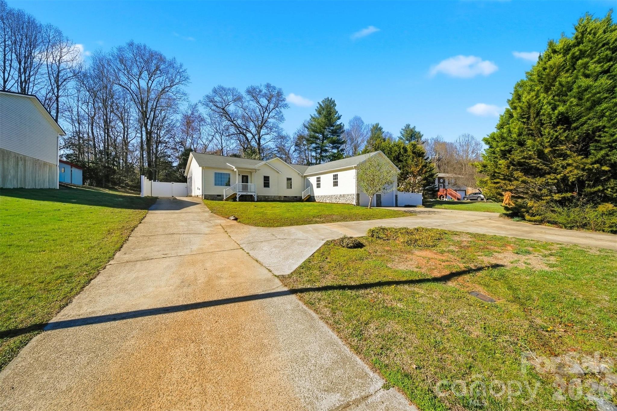 4771 Petra Mill Road Granite Falls, NC 28630 - Photo 1 of 46 a view of yard with swimming pool and trees in the background