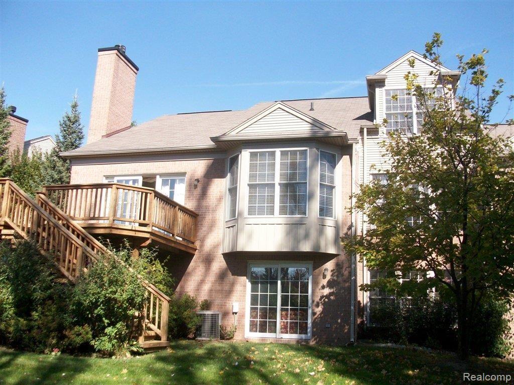 1892 Dunham Drive, Unit 14 Rochester, MI 48306 - Photo 20 of 20 dunham back view.jpg