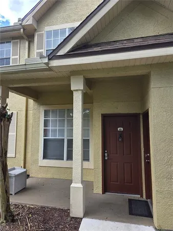 a front view of a house with a rug