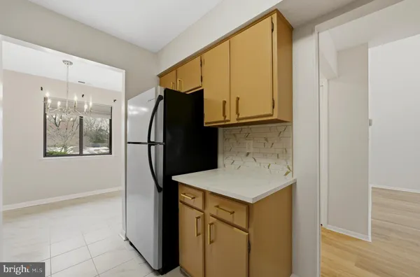 a kitchen with stainless steel appliances granite countertop a sink stove and microwave
