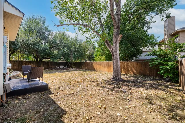 a backyard of a house with lots of green space