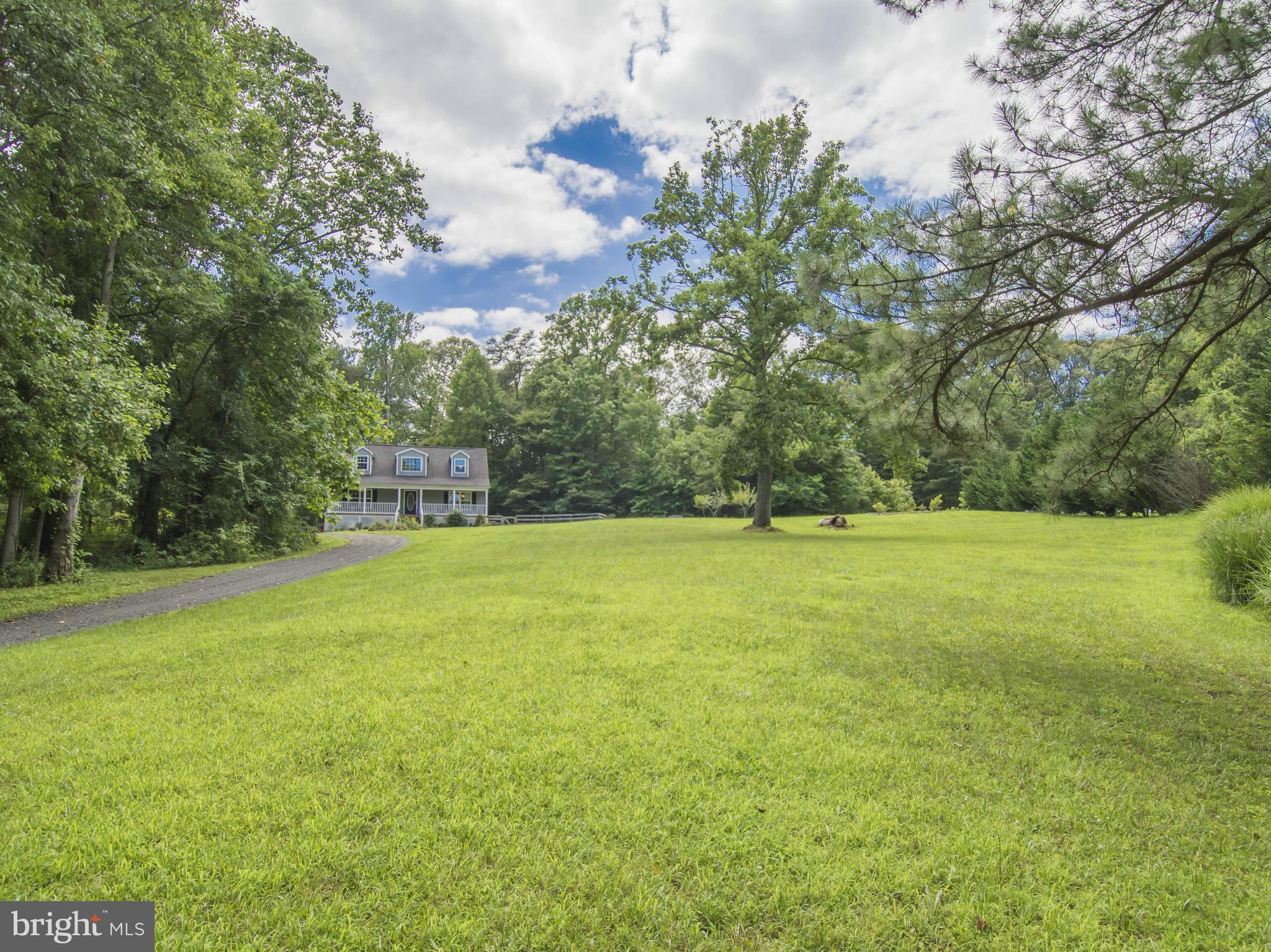 4330 Harvey Road Huntingtown, MD 20639 - Photo 1 of 30 a view of a big yard with large trees