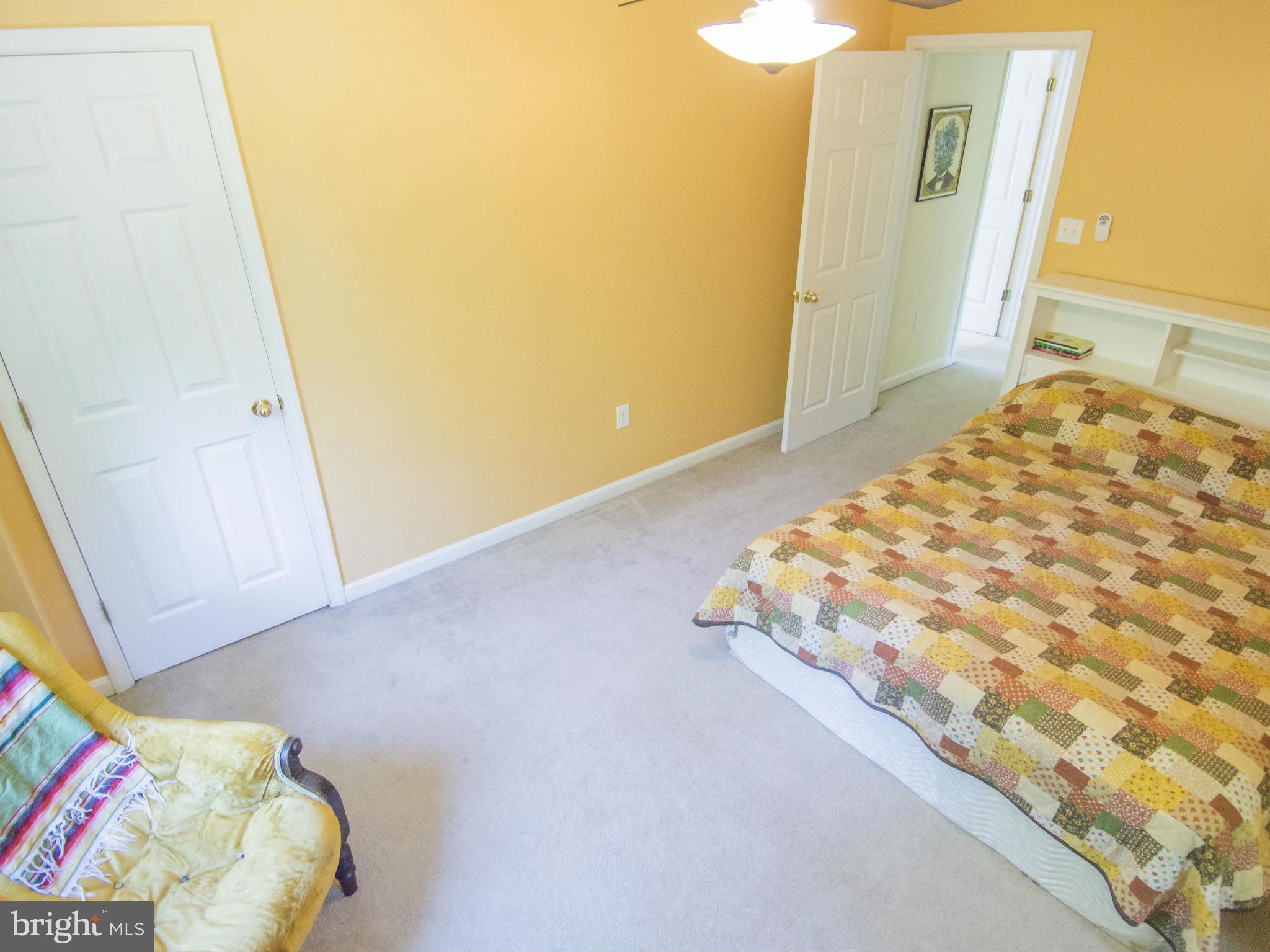 4330 Harvey Road Huntingtown, MD 20639 - Photo 22 of 30 a bedroom with a bed and a mirror