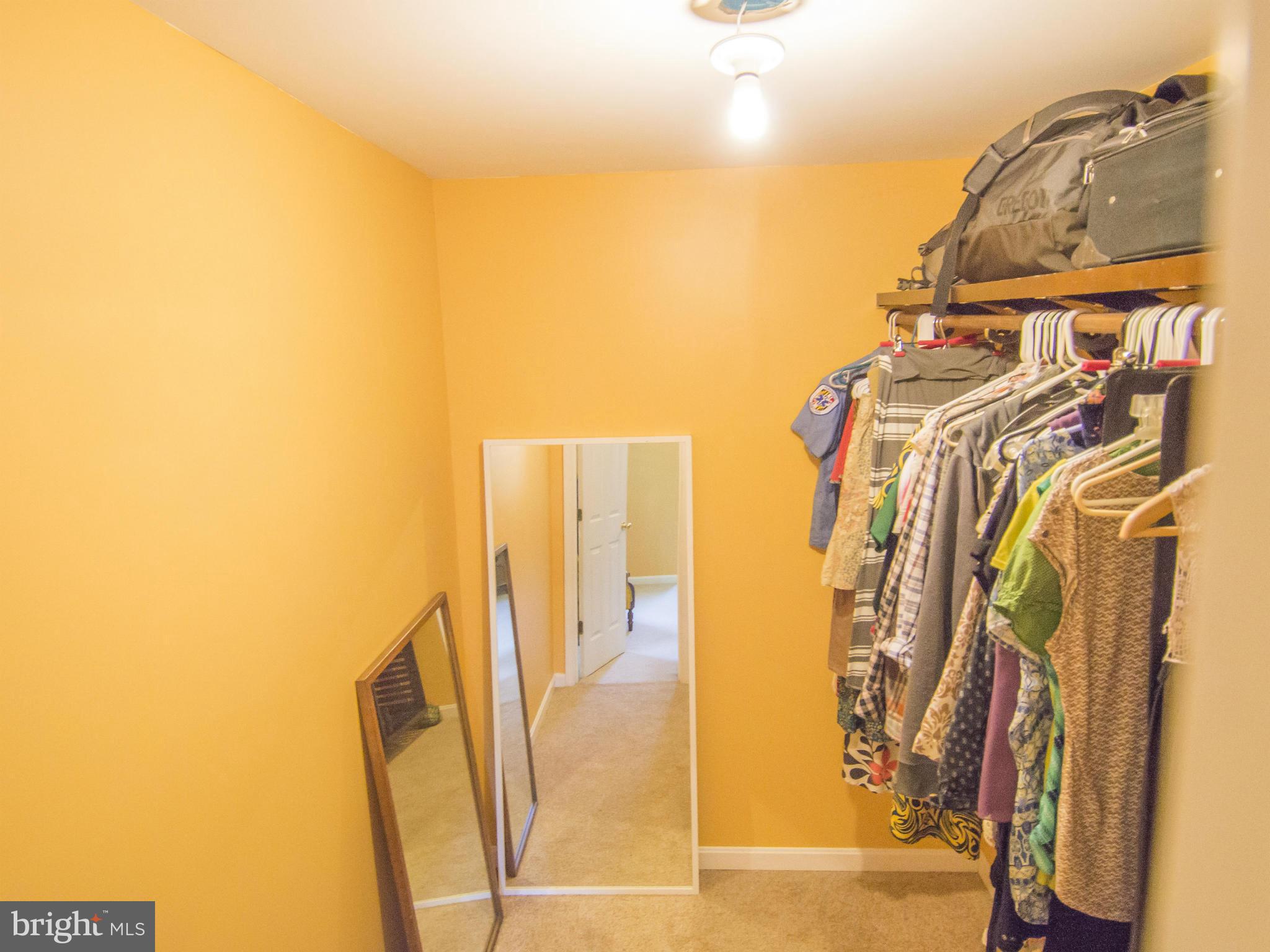 4330 Harvey Road Huntingtown, MD 20639 - Photo 23 of 30 a view of walk in closet with clothes