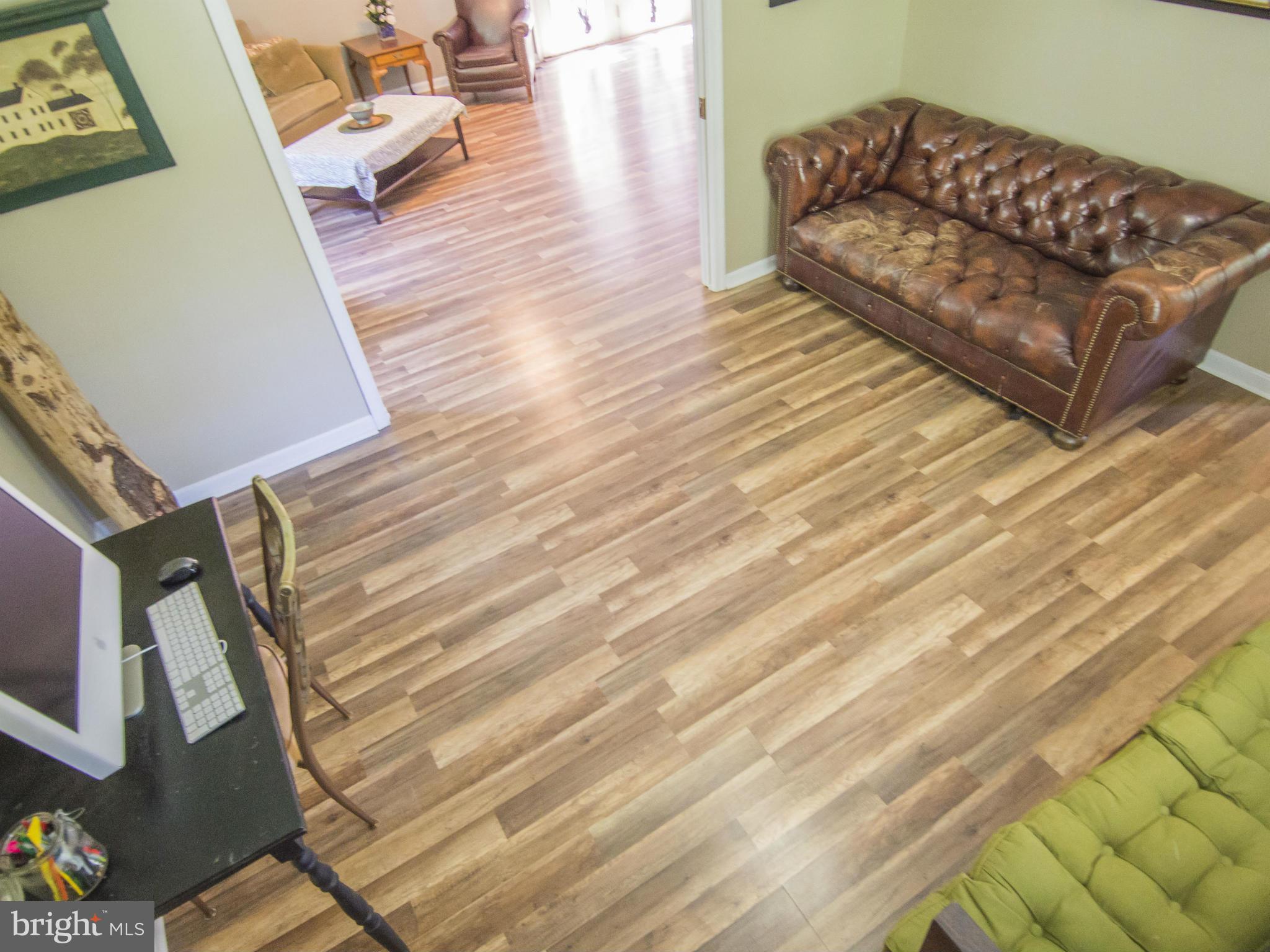 4330 Harvey Road Huntingtown, MD 20639 - Photo 6 of 30 a living room with furniture and a wooden floor