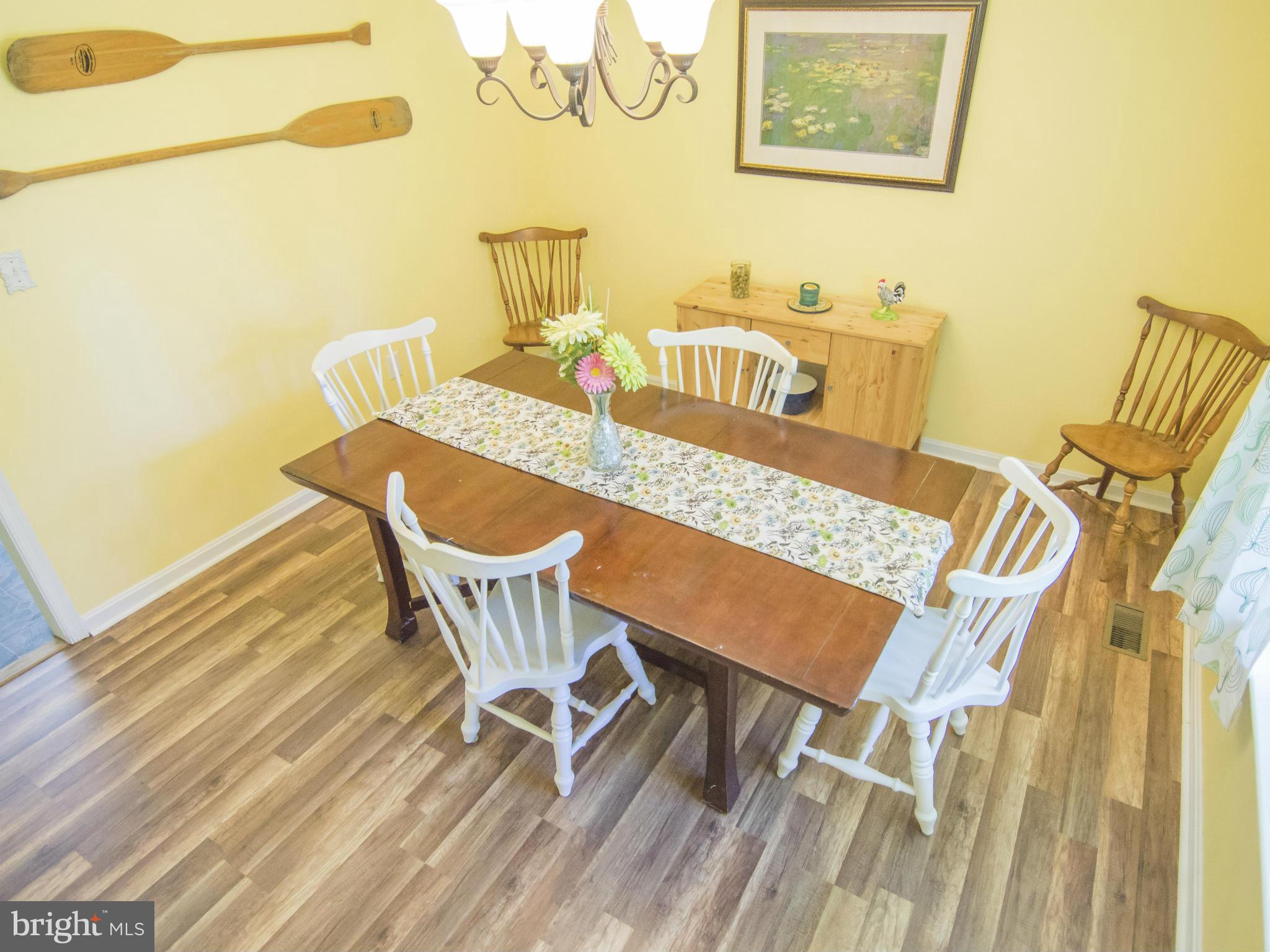 4330 Harvey Road Huntingtown, MD 20639 - Photo 7 of 30 a view of a dining room with furniture and wooden floor