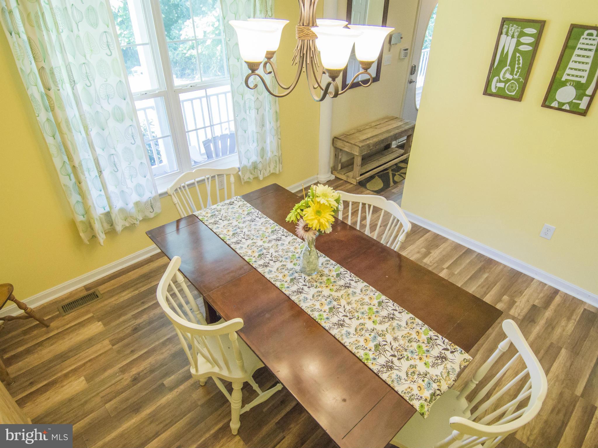 4330 Harvey Road Huntingtown, MD 20639 - Photo 8 of 30 a bedroom with a bed and wooden floor