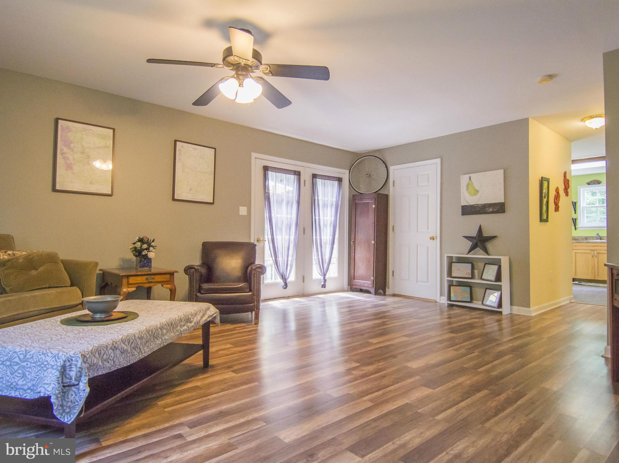 4330 Harvey Road Huntingtown, MD 20639 - Photo 9 of 30 a living room with furniture and a wooden floor
