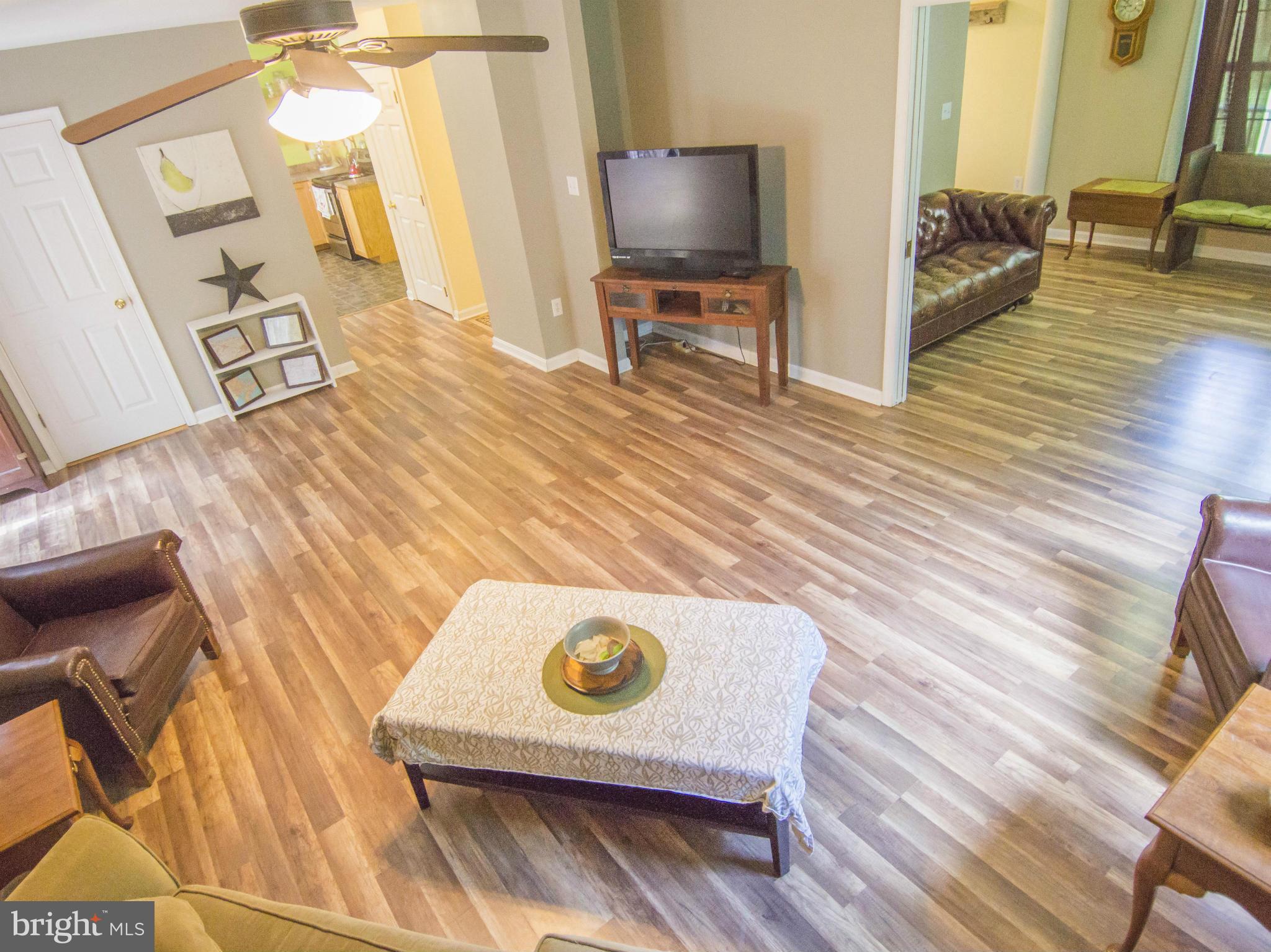 4330 Harvey Road Huntingtown, MD 20639 - Photo 10 of 30 a living room with furniture and a flat screen tv