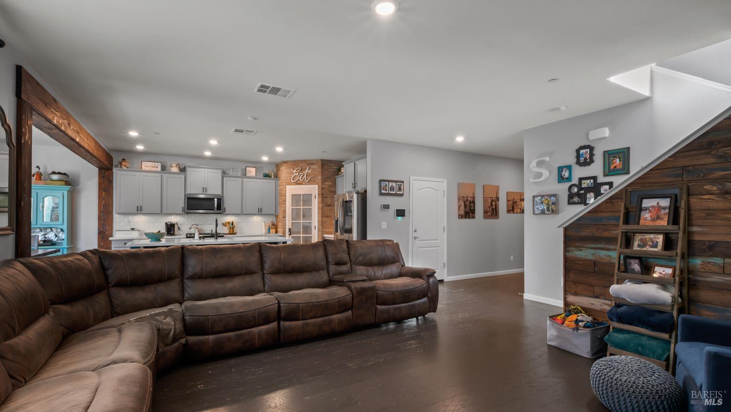 2382 Sheldon Drive Fairfield, CA 94533 - Photo 12 of 63 a living room with furniture a wooden floor and a large window