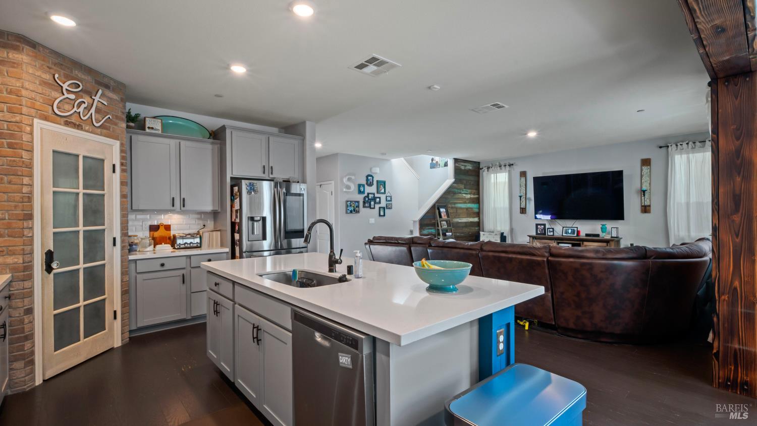 2382 Sheldon Drive Fairfield, CA 94533 - Photo 18 of 63 a kitchen that has a lot of cabinets a sink and appliances in it
