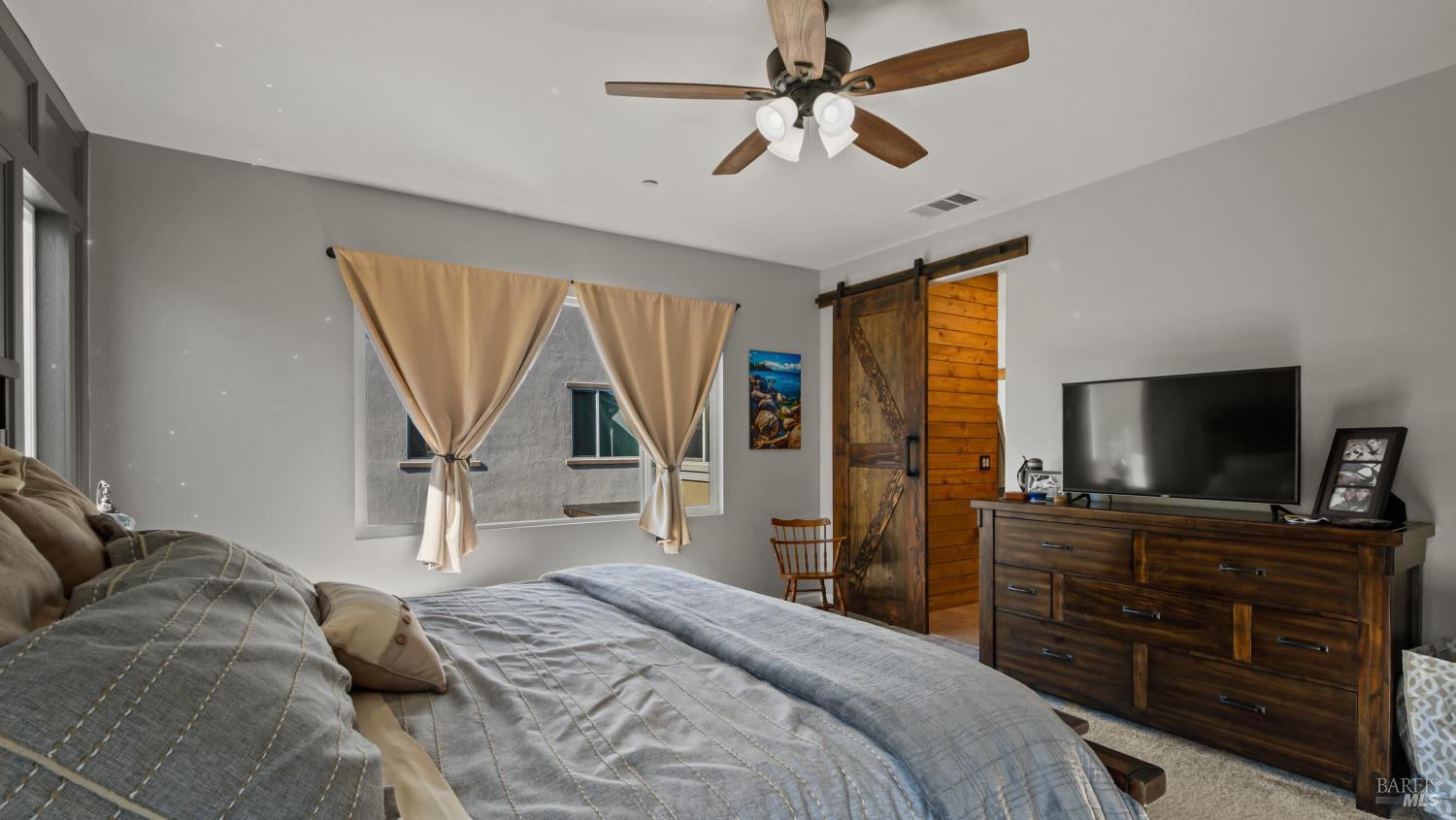 2382 Sheldon Drive Fairfield, CA 94533 - Photo 29 of 63 a bedroom with a bed and a flat screen television