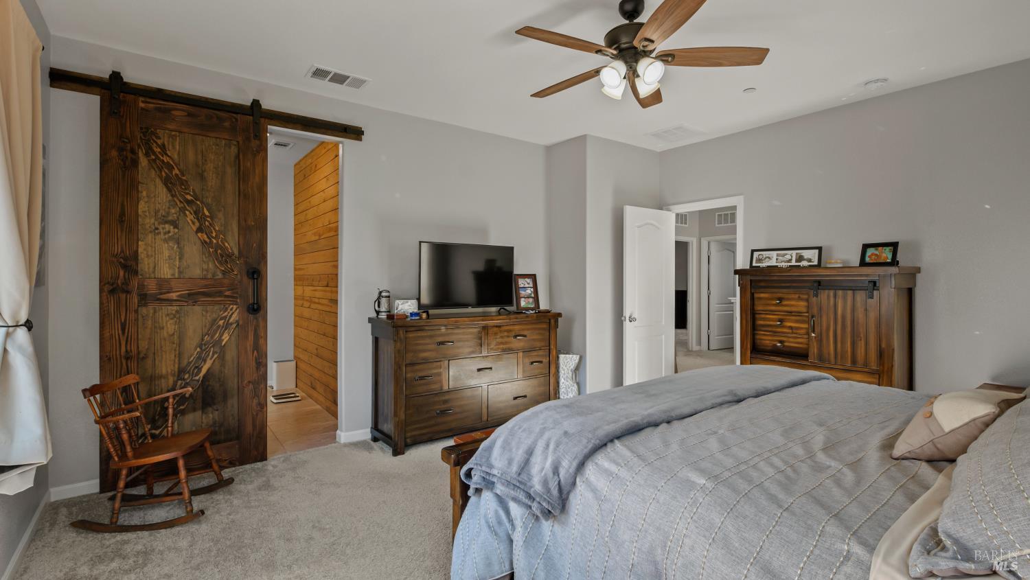 2382 Sheldon Drive Fairfield, CA 94533 - Photo 30 of 63 a bedroom with a bed and a flat tv screen