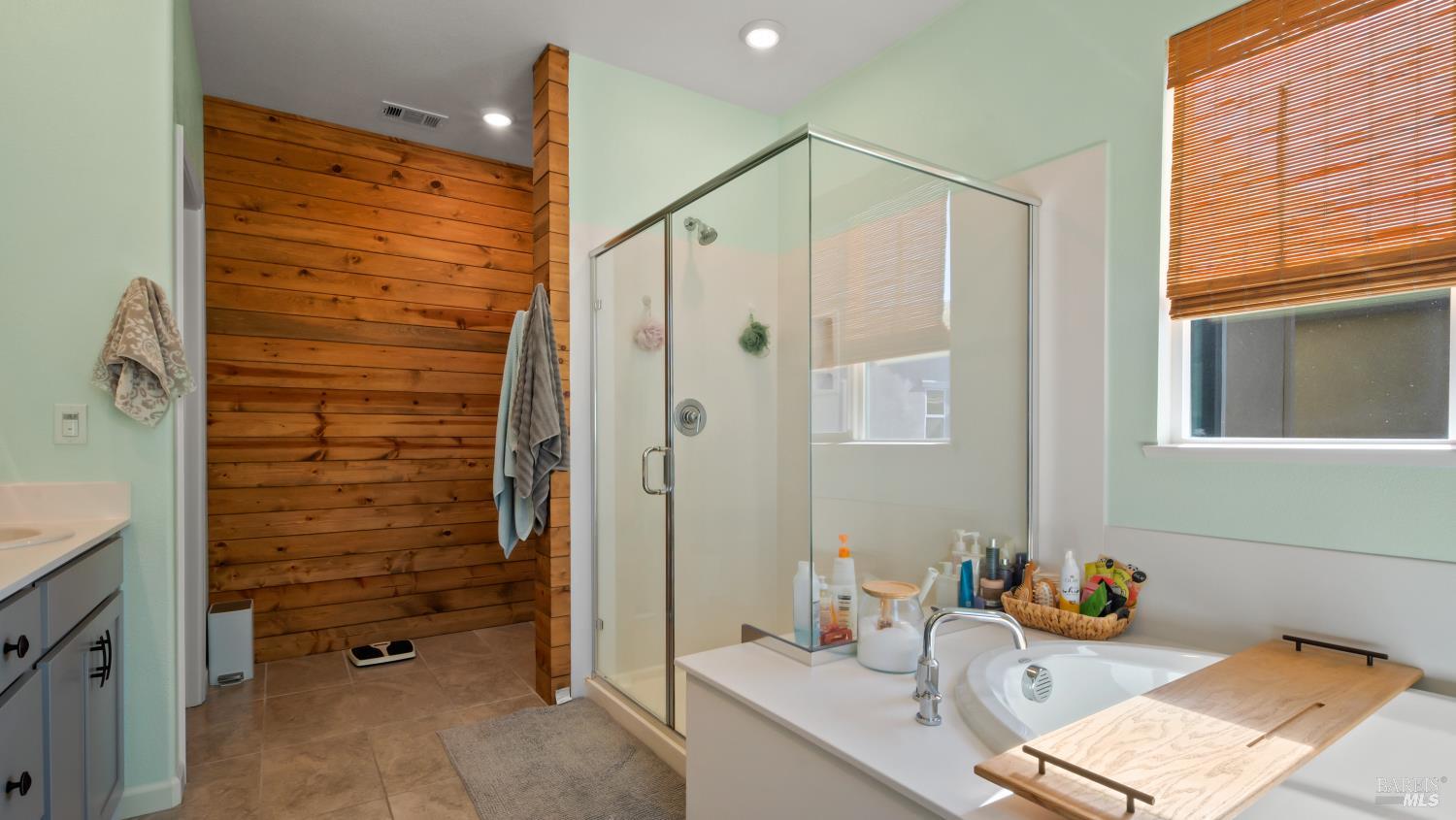 2382 Sheldon Drive Fairfield, CA 94533 - Photo 33 of 63 a bathroom with a granite countertop sink a mirror and shower
