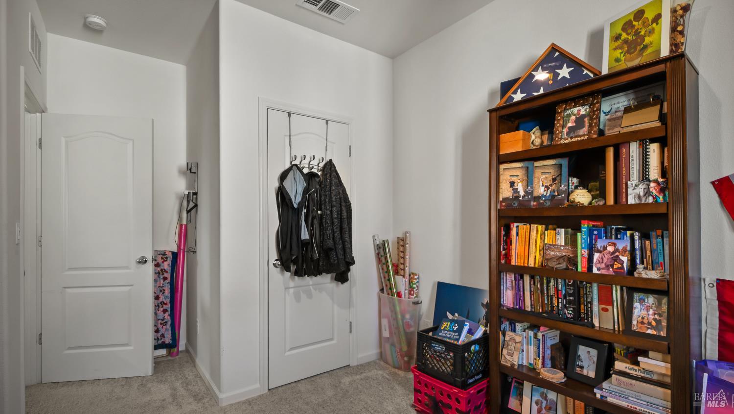 2382 Sheldon Drive Fairfield, CA 94533 - Photo 40 of 63 a view of walk in closet with clothes and shoes