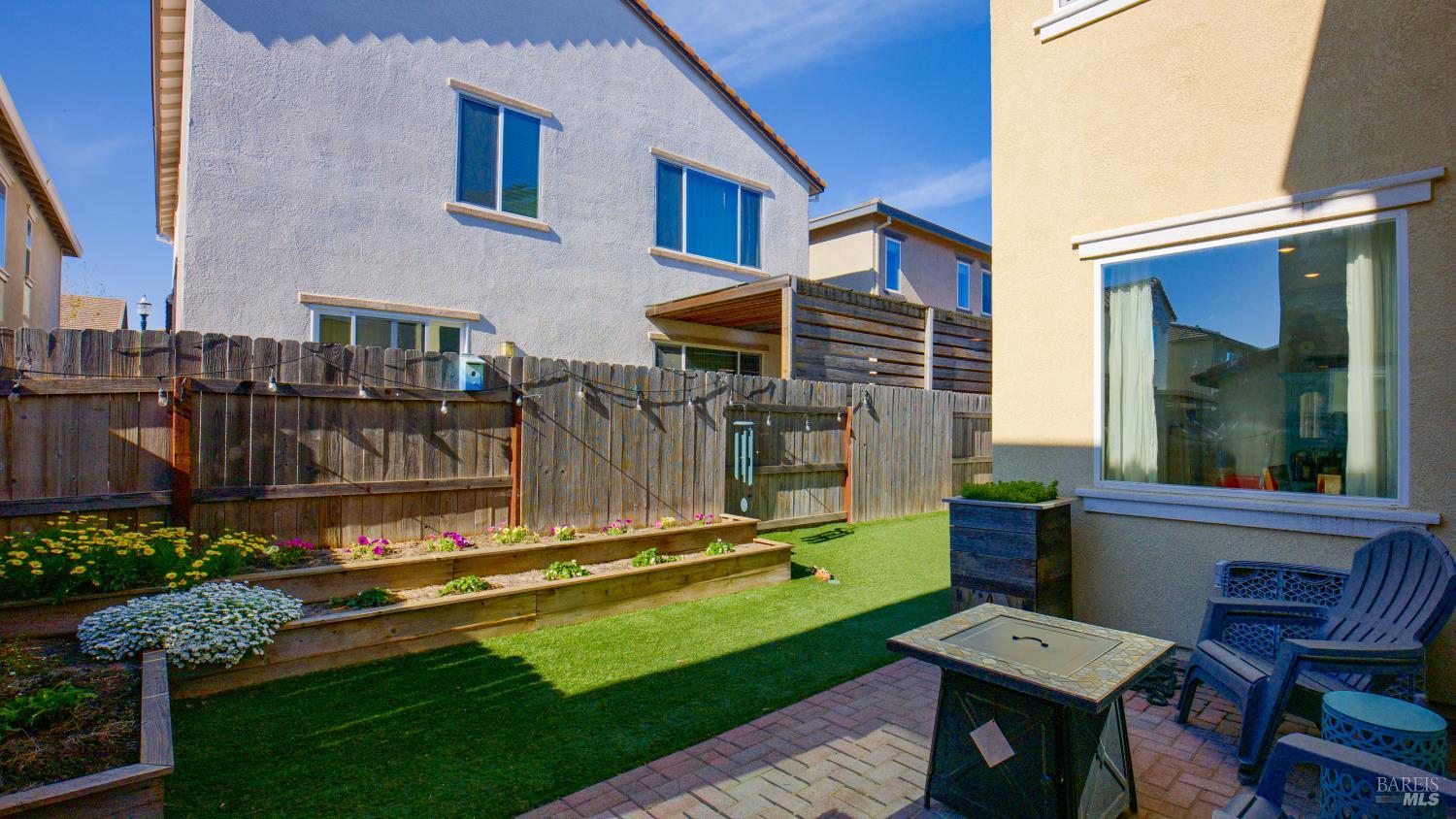 2382 Sheldon Drive Fairfield, CA 94533 - Photo 45 of 63 a backyard of a house with barbeque oven table and chairs