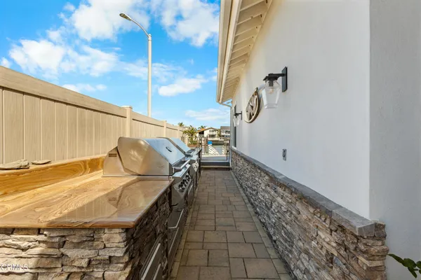 an aerial view of a house with a ocean view