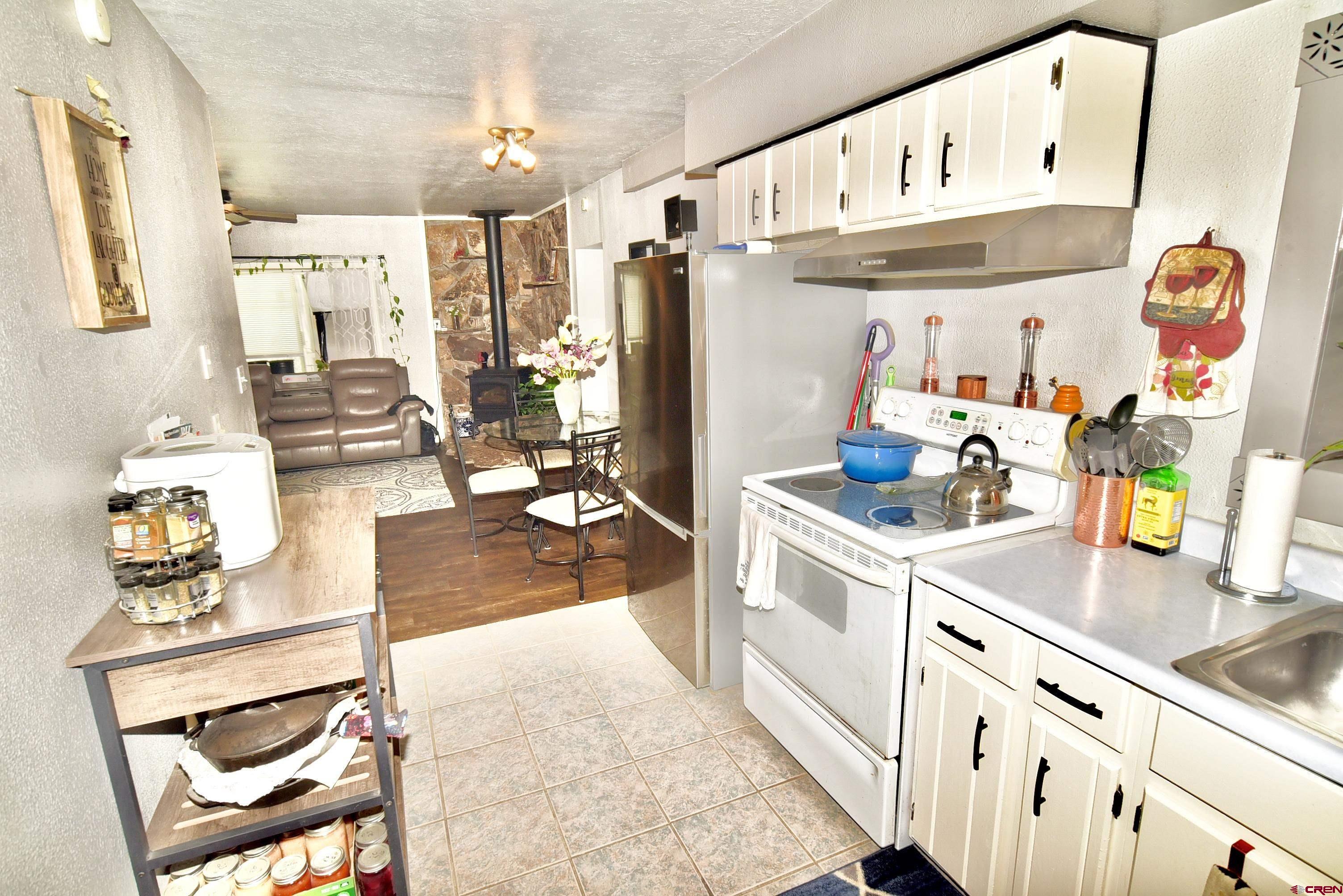 839 B Street Delta, CO 81416 - Photo 12 of 27 a kitchen with stainless steel appliances granite countertop a sink and cabinets