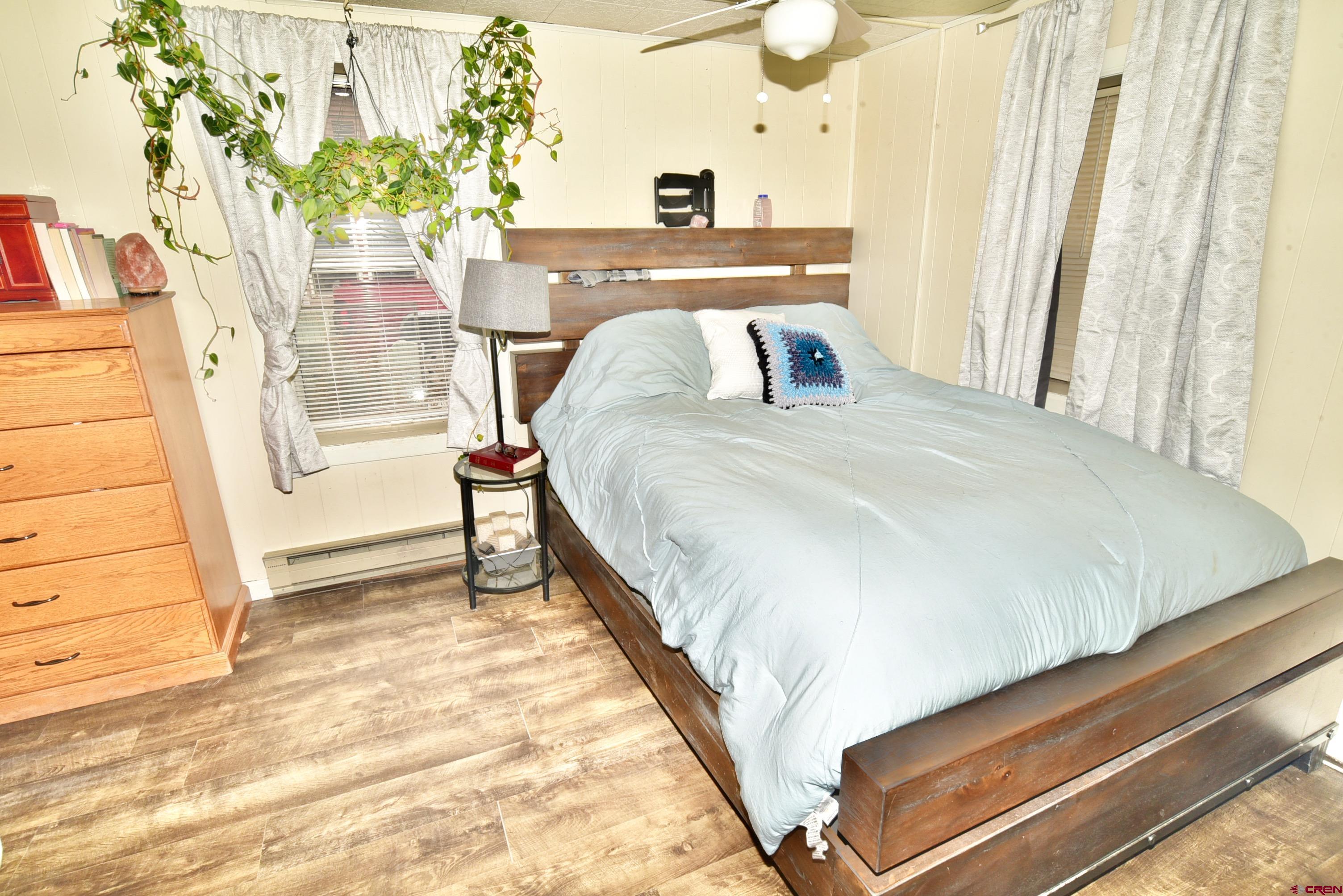 839 B Street Delta, CO 81416 - Photo 16 of 27 a bed sitting in a bedroom next to a window