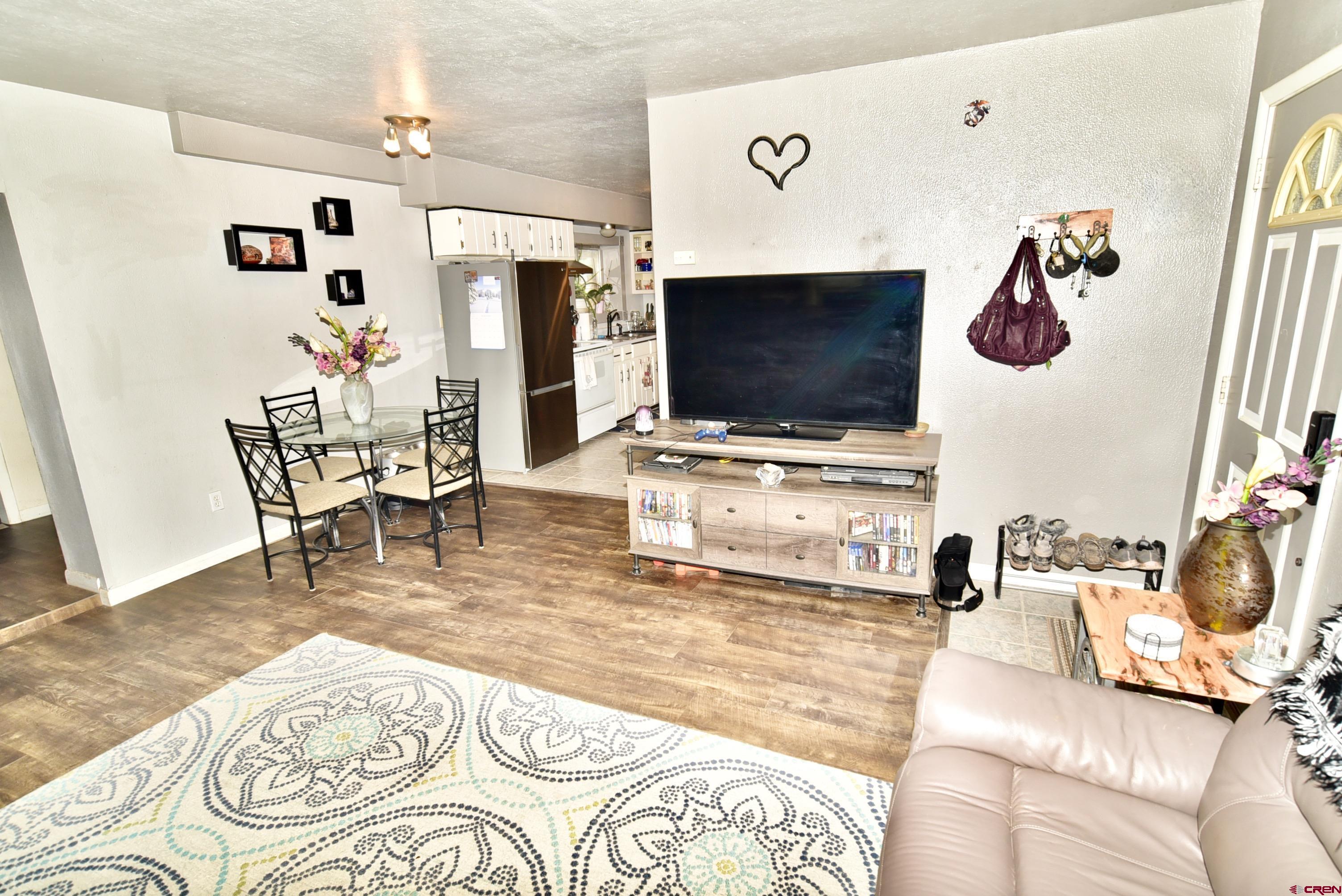 839 B Street Delta, CO 81416 - Photo 4 of 27 a living room with furniture and a flat screen tv