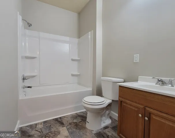 a bathroom with a sink toilet and bathtub
