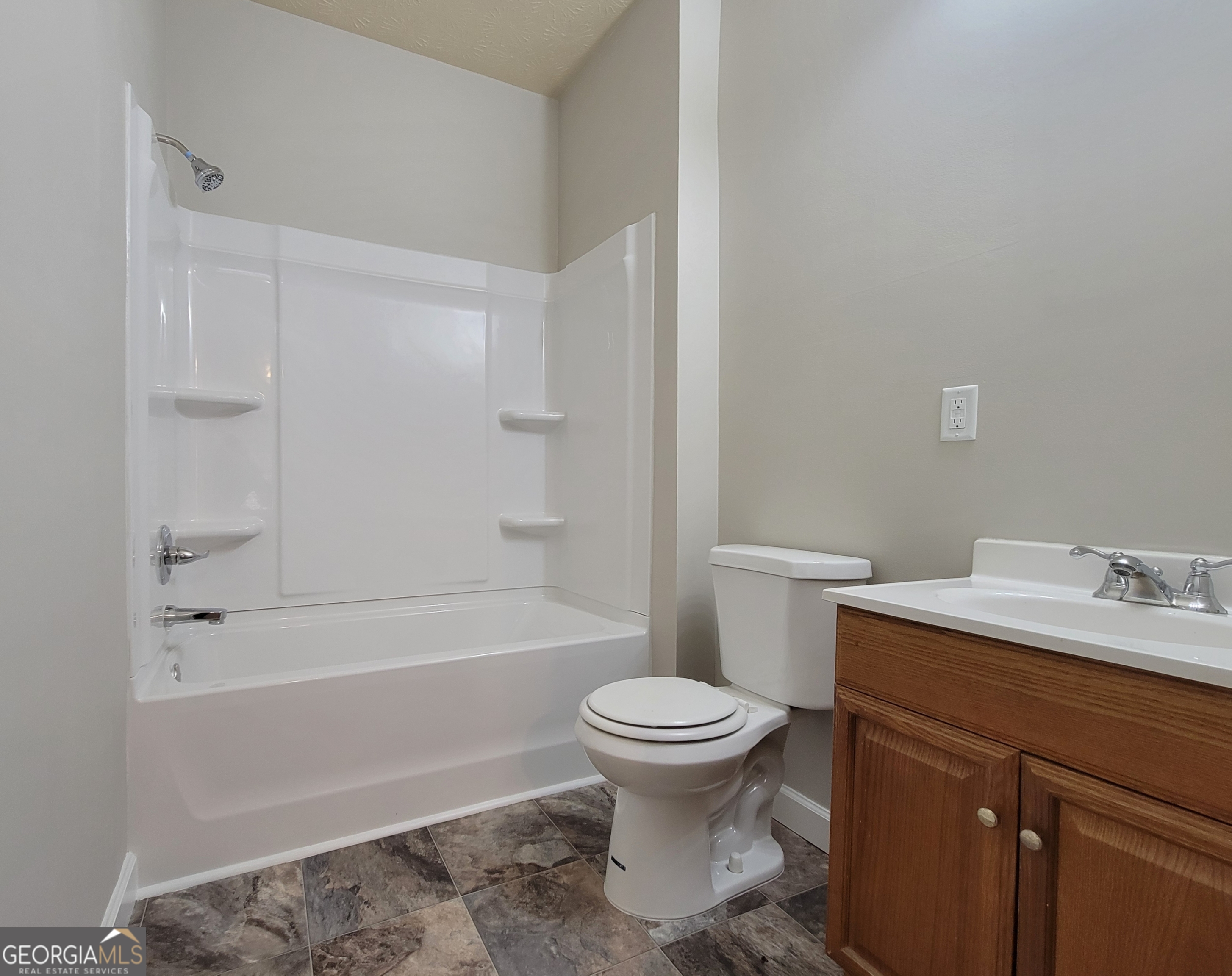 160 North Broad Street, Unit B Winder, GA 30680 - Photo 5 of 7 a bathroom with a sink toilet and bathtub