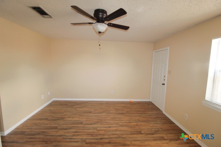 304 Erby Avenue, Unit C Copperas Cove, TX 76522 - Photo 8 of 9 wooden floor in an empty room