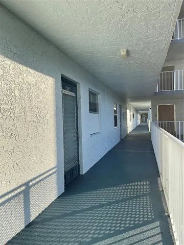 a view of a lake with houses in the back