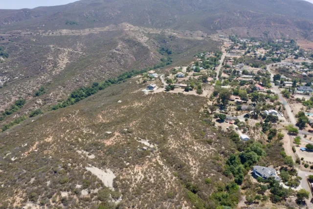 an aerial view of residential house and green space