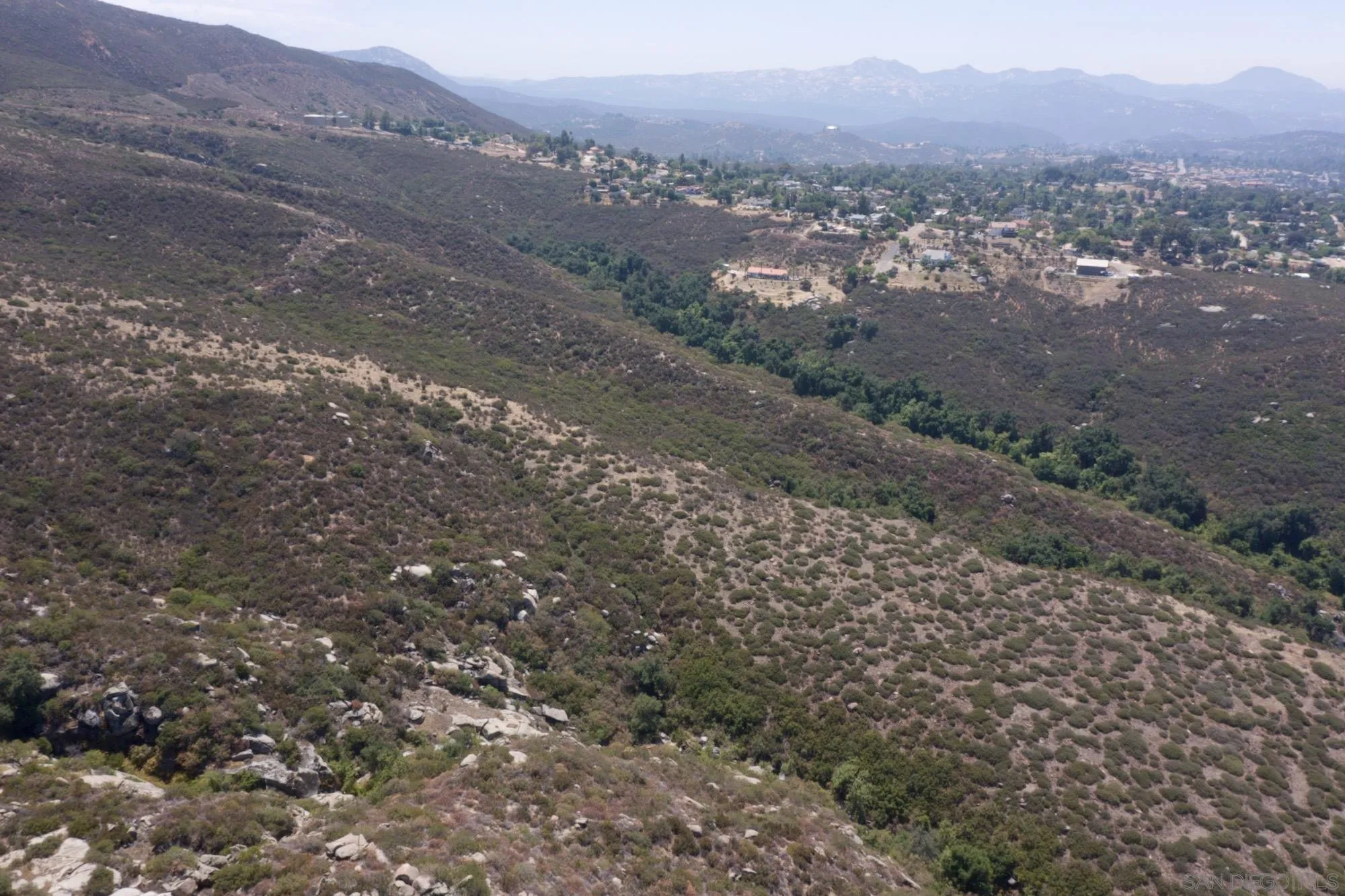 Victoria Drive, Unit 18 Alpine, CA 91901 - Photo 26 of 58 a view of a road with mountains in the background