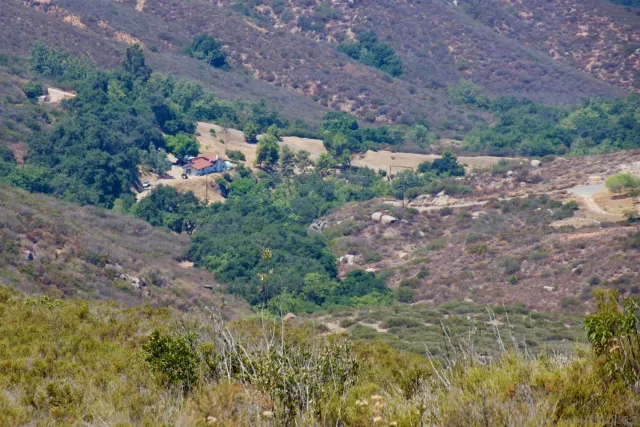 an aerial view of residential house and green space