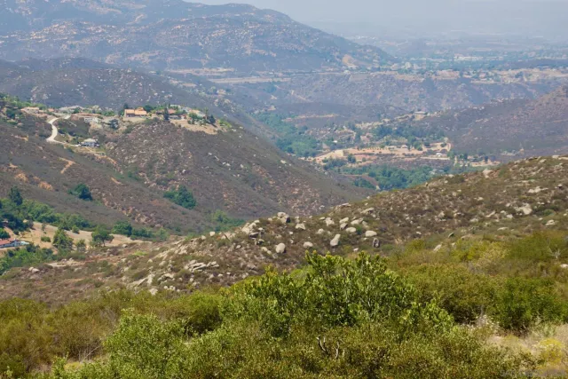 a view of mountains and valleys