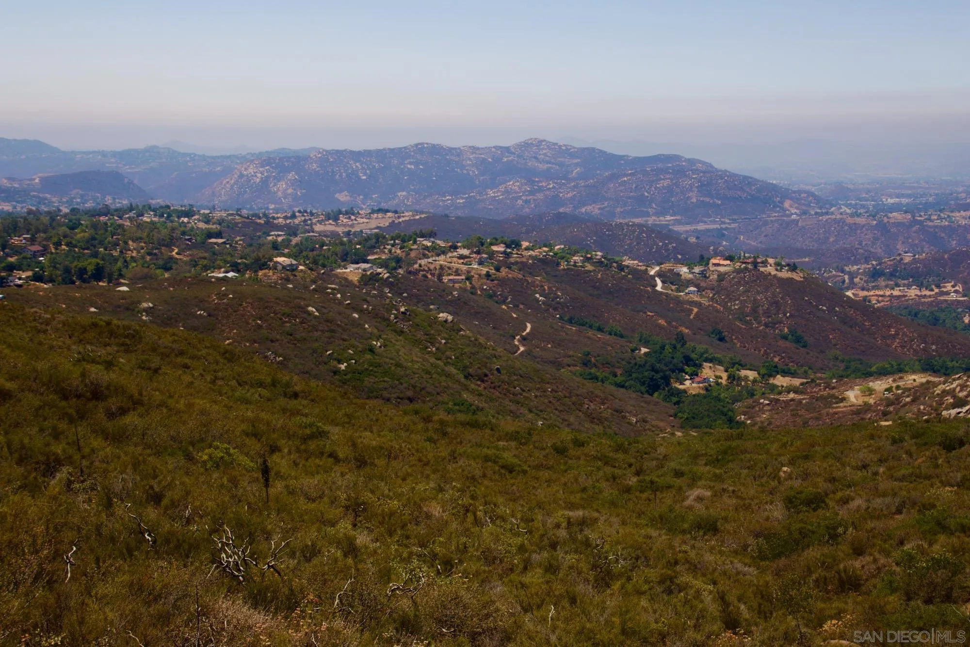 Victoria Drive, Unit 18 Alpine, CA 91901 - Photo 52 of 58 an aerial view of residential house and green space