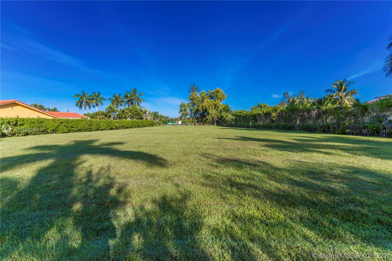 0 Ranch Road Weston, FL 33326 - Photo 15 of 16 a view of a grassy field with an trees