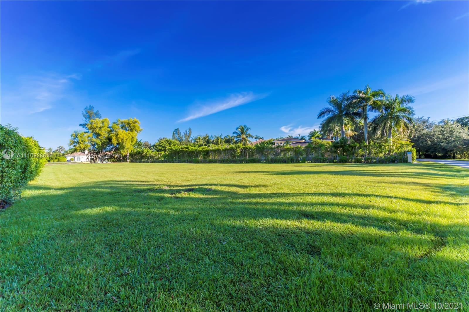 0 Ranch Road Weston, FL 33326 - Photo 16 of 16 a view of a golf course with a lake
