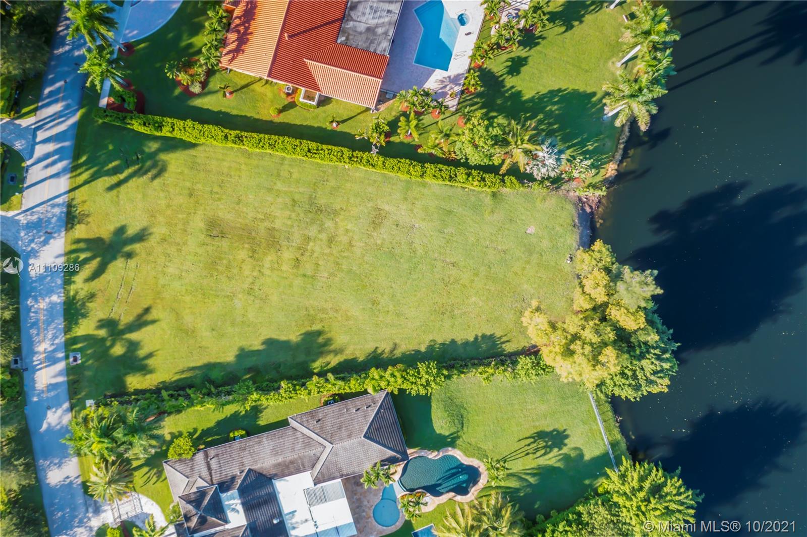 0 Ranch Road Weston, FL 33326 - Photo 5 of 16 a view of a lake with a houses