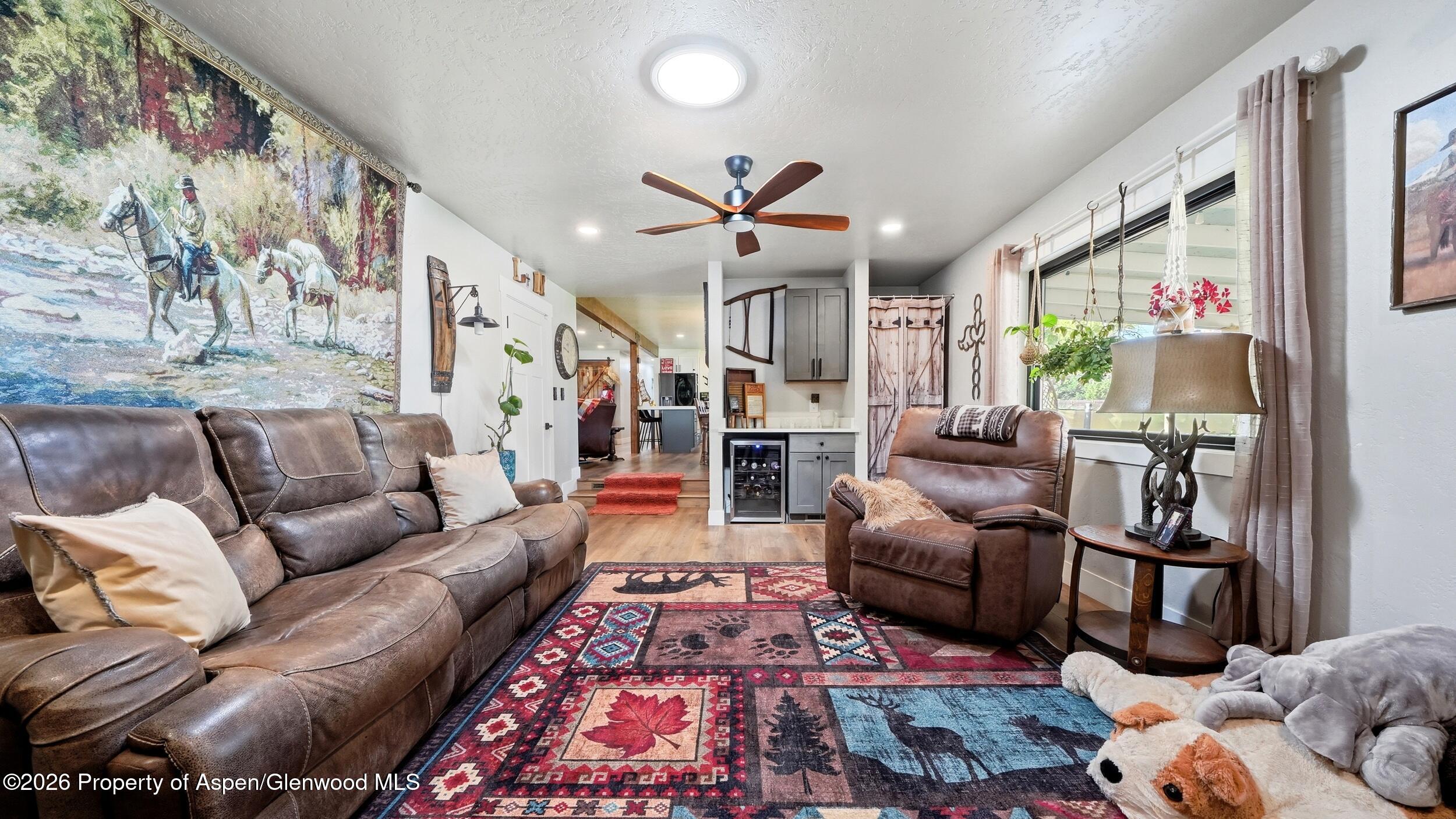 445 South Camp Road Grand Junction, CO 81507 - Photo 16 of 37 a living room with furniture ceiling fan and rug
