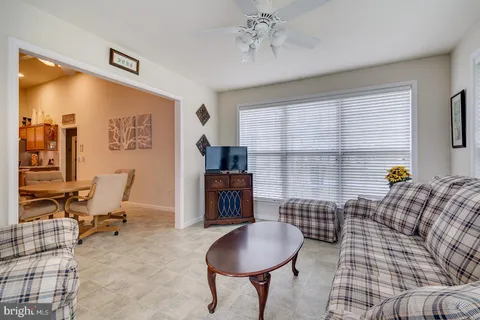 a bedroom with furniture and a chandelier