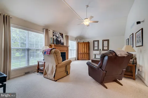 a bedroom with bed and a chandelier